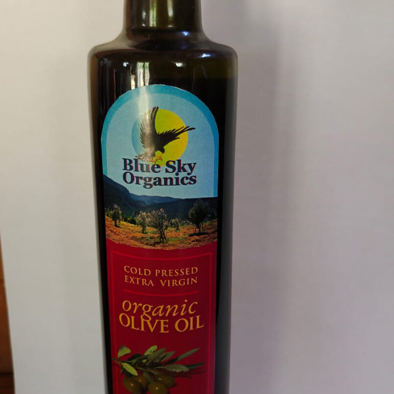 This is a product image showcasing our Olive Oil. Made with a blend of two Italian cultivars, it is extra virgin and cold-pressed, offering a rich and balanced flavour profile.