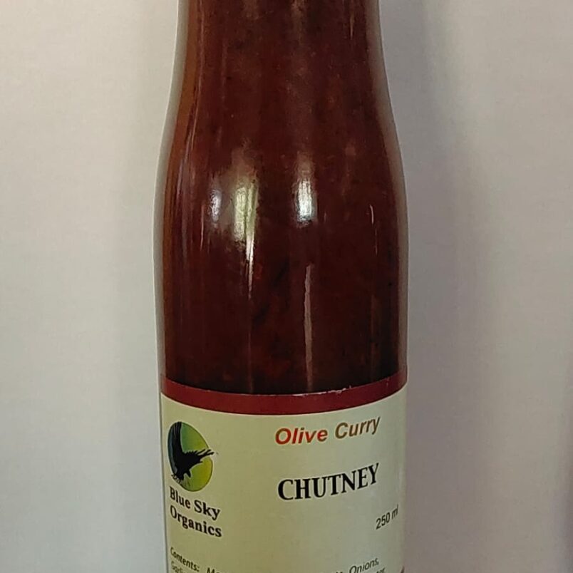 This is a product image showcasing our Olive Curry Chutney. Made with Manzanilla olives, apricots, and curry spices, it is a versatile condiment that adds a burst of flavour to your meals.