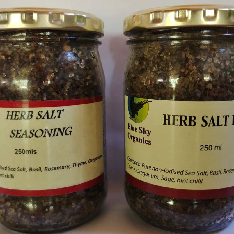 This is a product image showcasing our natural, non-iodized mixed herb sea salt rub and our organic mixed herb salt seasoning. Both products are available for online ordering in South Africa.